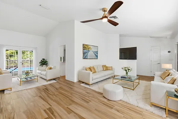a living room with furniture and a flat screen tv
