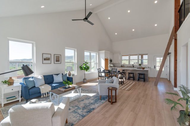 1820 West Farmhouse Flats Road Peoa, UT 84061 - Photo 62 of 79 Vaulted ceilings enhance the expansive living area with wood-finish flooring