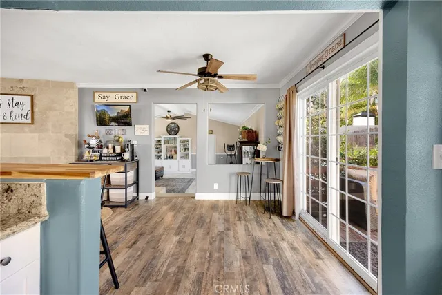 a large kitchen with stainless steel appliances kitchen island granite countertop a stove and a sink