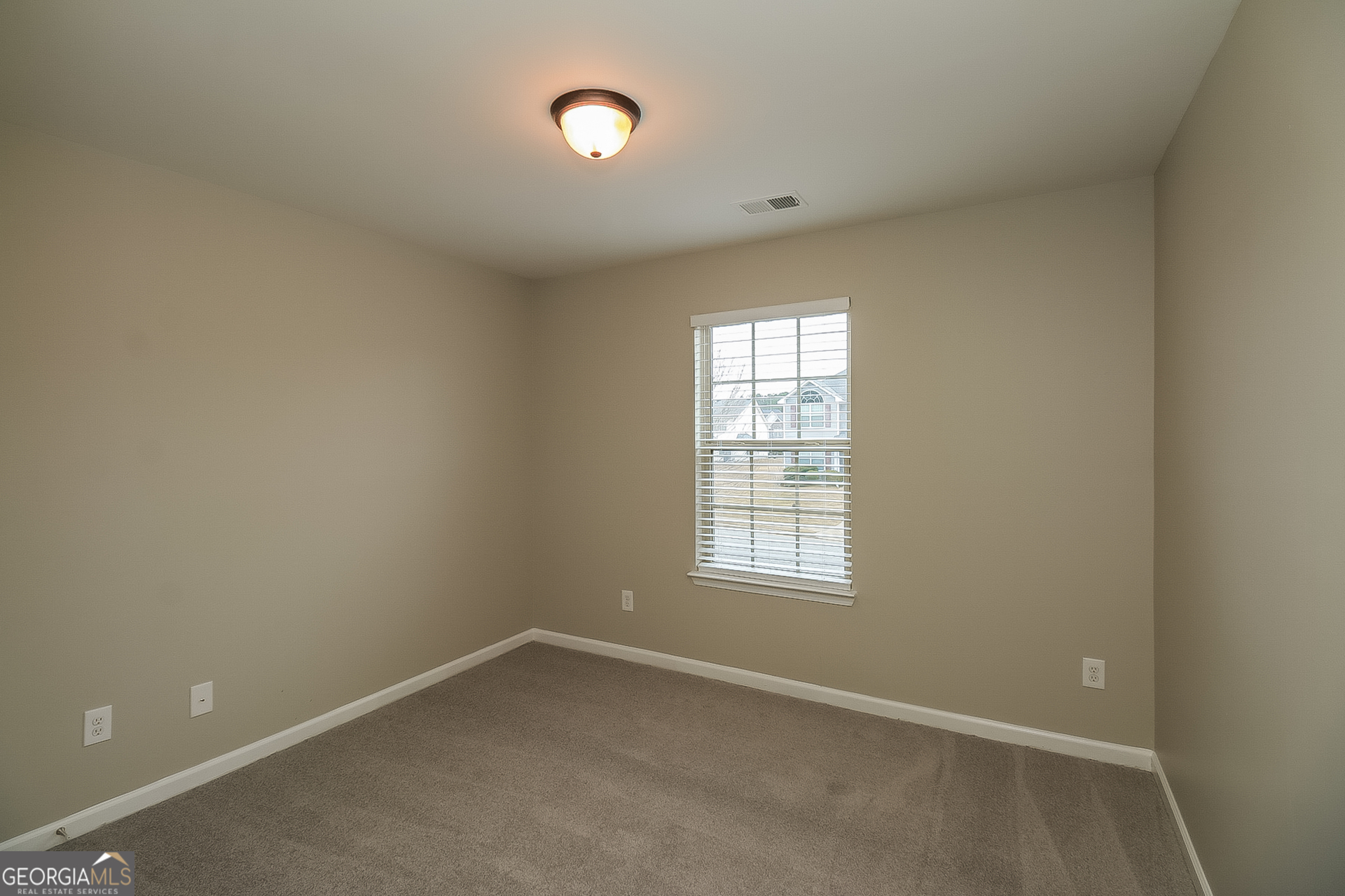 7826 Bell Tower Lane Fairburn, GA 30213 - Photo 11 of 17 an empty room with a window