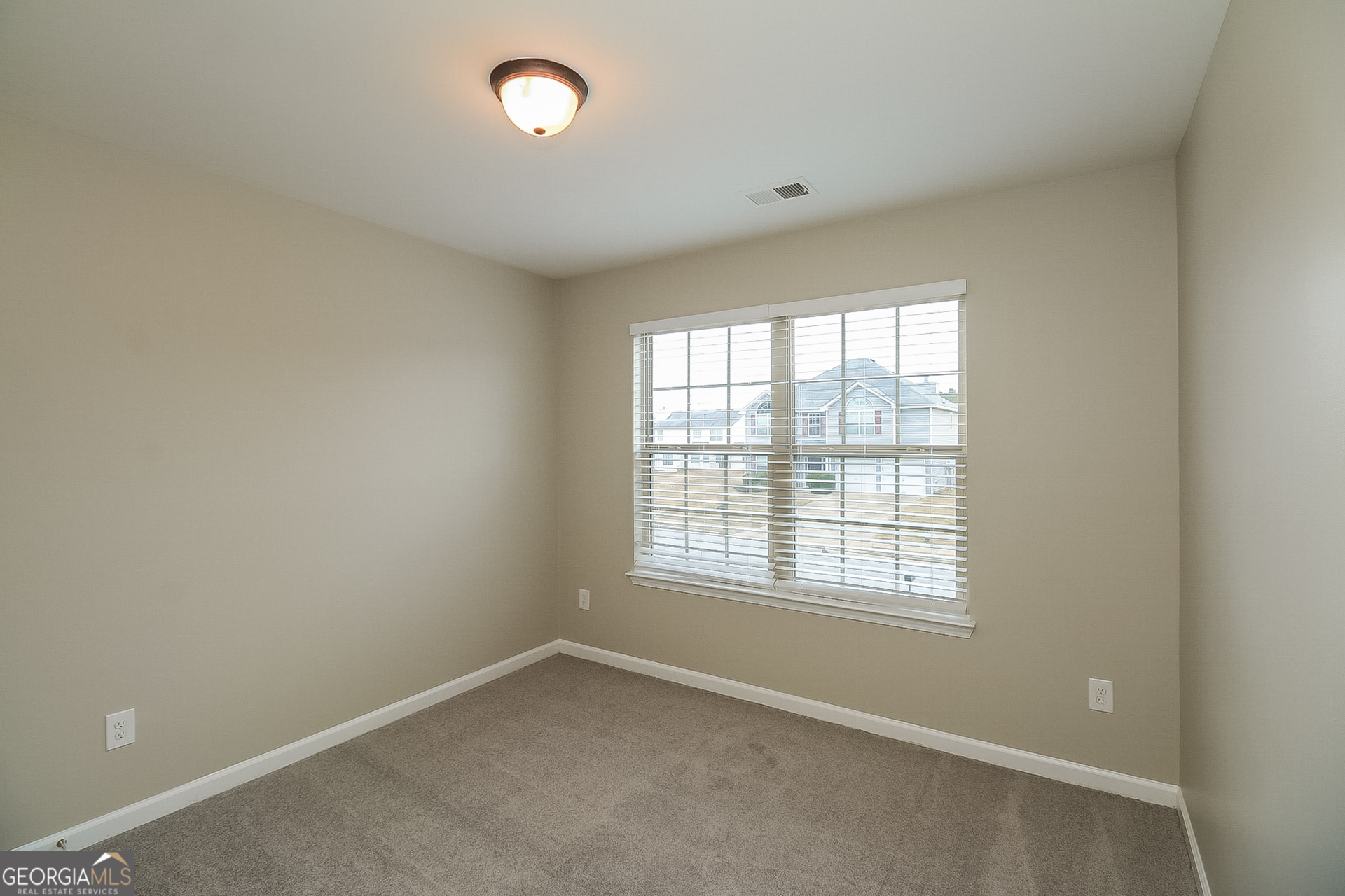 7826 Bell Tower Lane Fairburn, GA 30213 - Photo 12 of 17 an empty room with a window