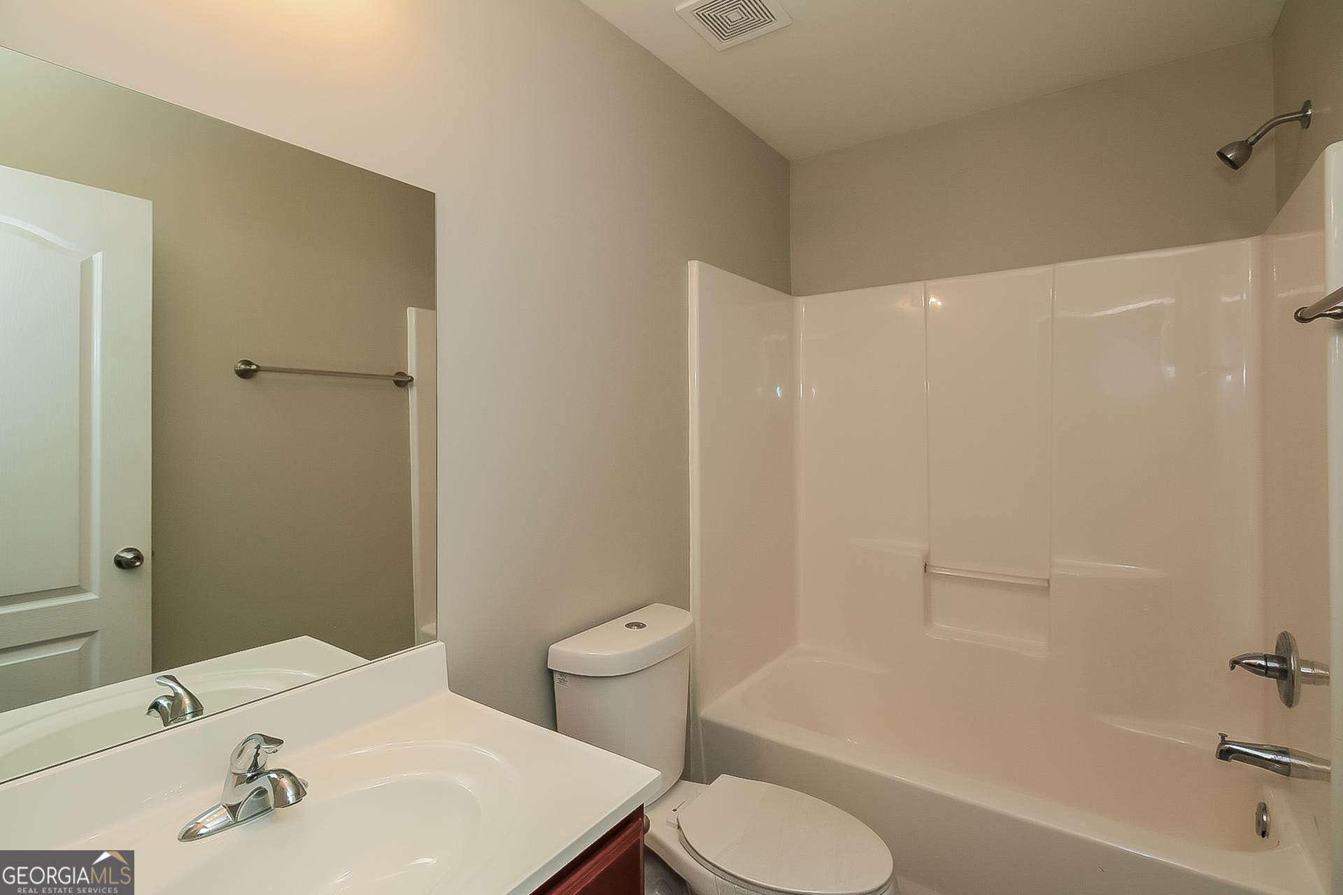 7826 Bell Tower Lane Fairburn, GA 30213 - Photo 14 of 17 a bathroom with a sink toilet and shower