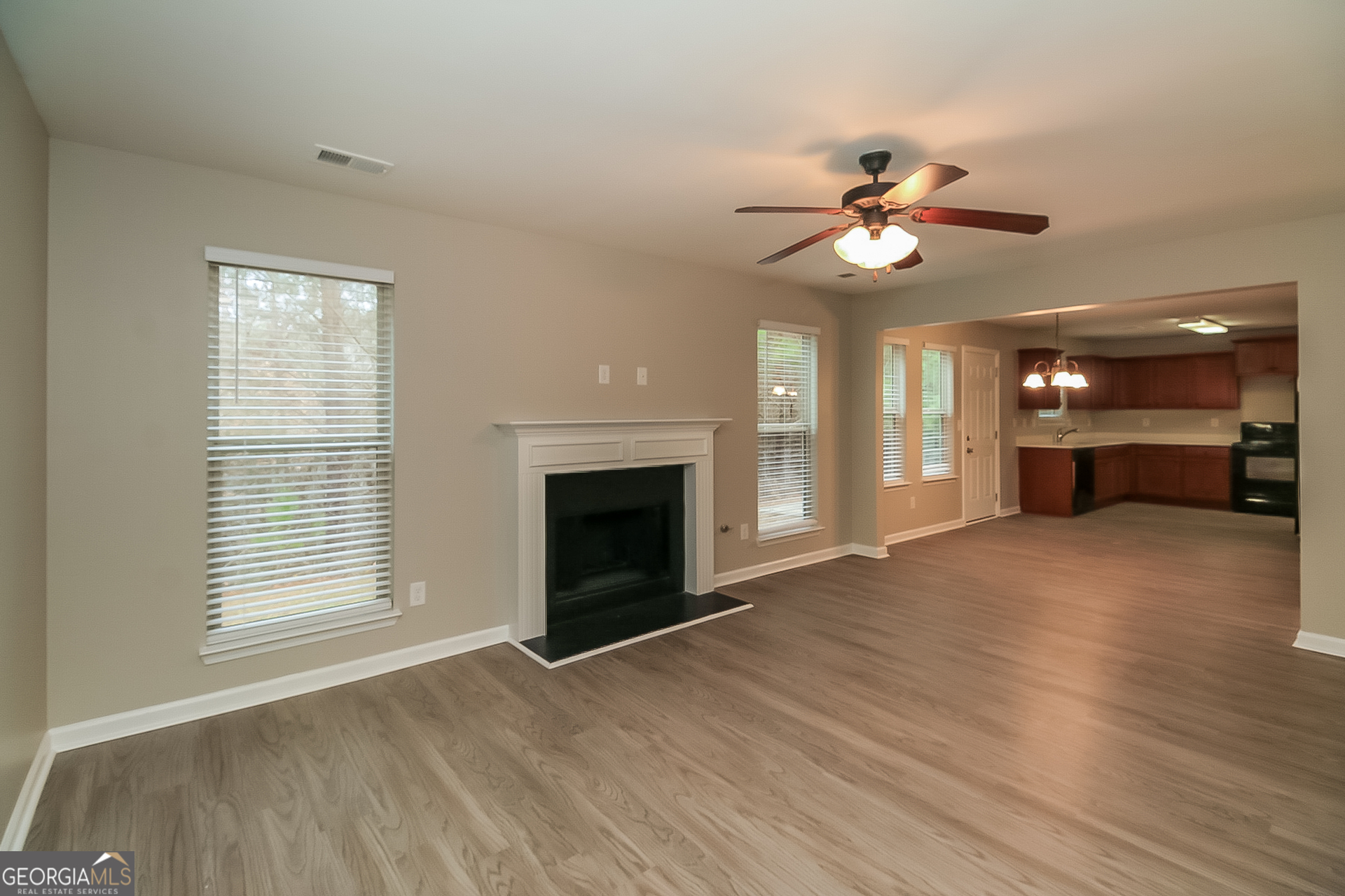 7826 Bell Tower Lane Fairburn, GA 30213 - Photo 2 of 17 a view of livingroom window fireplace