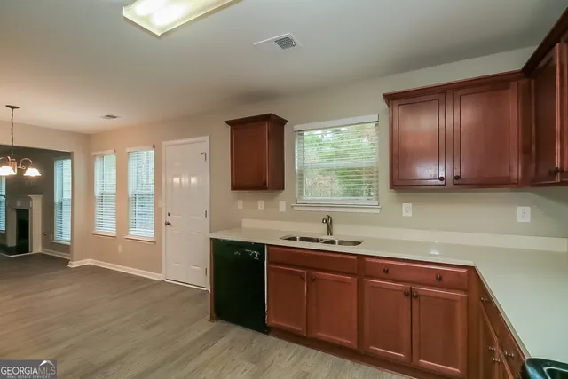 a kitchen with a sink and cabinets