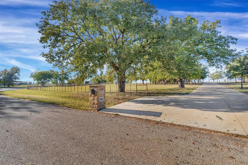 3031 Powell Cemetery Road Tolar, TX 76476 - Photo 2 of 40 a view of backyard with swimming pool and green space