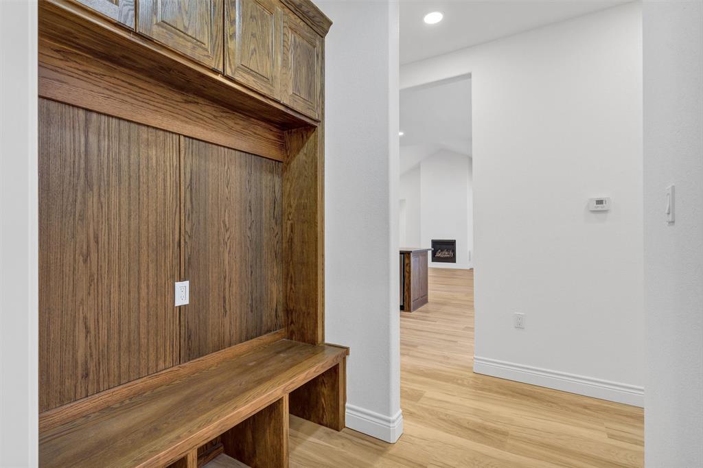 3031 Powell Cemetery Road Tolar, TX 76476 - Photo 21 of 40 a view of a hallway with wooden floor and furniture