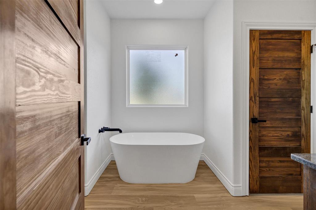 3031 Powell Cemetery Road Tolar, TX 76476 - Photo 26 of 40 a view of a bathtub in bathroom
