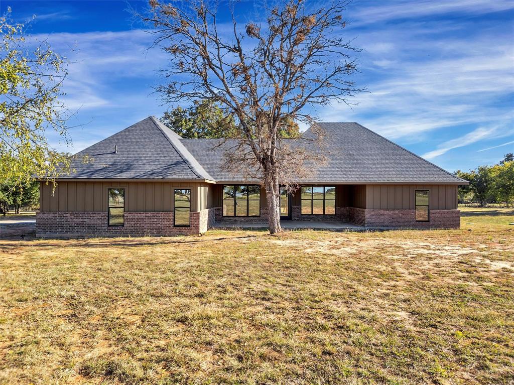 3031 Powell Cemetery Road Tolar, TX 76476 - Photo 35 of 40 a front view of a house with a yard