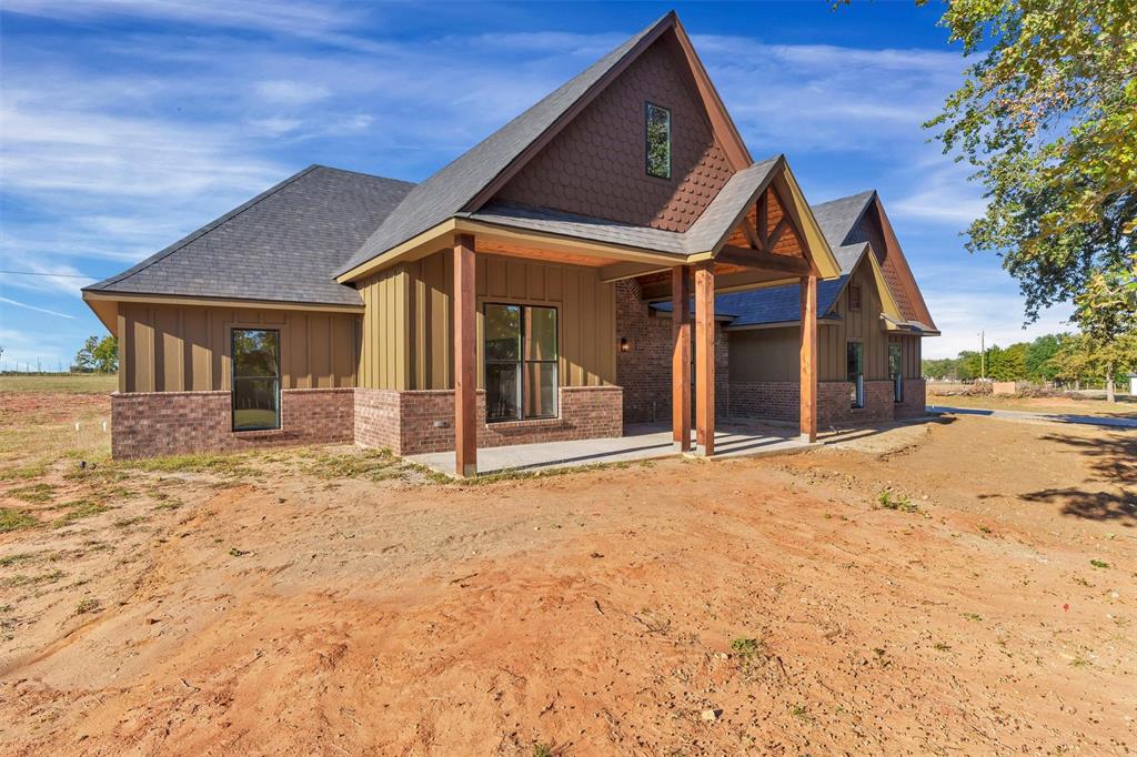 3031 Powell Cemetery Road Tolar, TX 76476 - Photo 5 of 40 a front view of a house with a yard