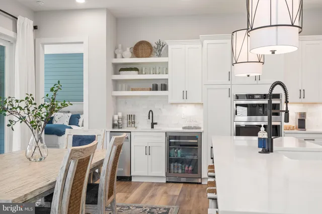 a kitchen with stainless steel appliances kitchen island granite countertop a sink and cabinets