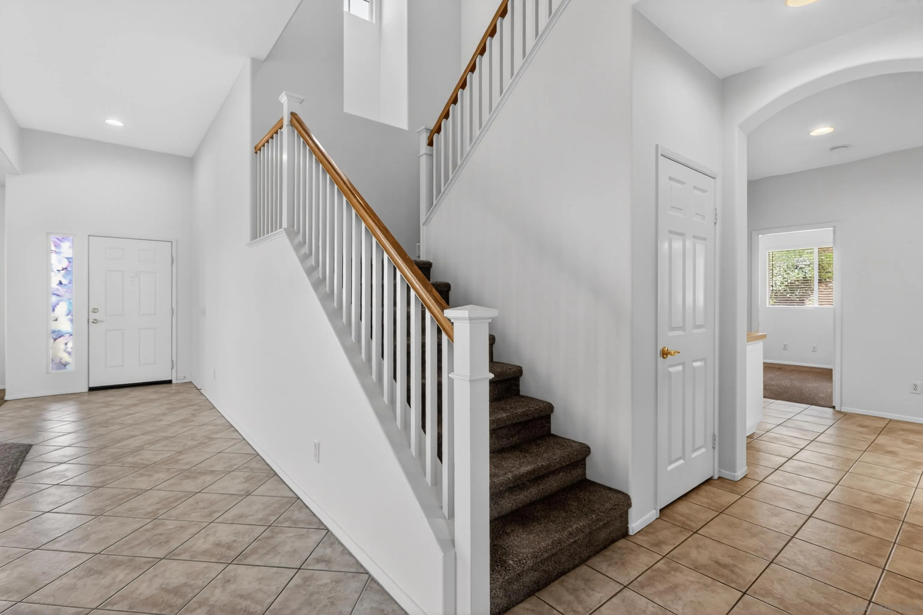 1432 Belmont Park Road Oceanside, CA 92057 - Photo 43 of 54 a view of a hallway with entryway and stairs