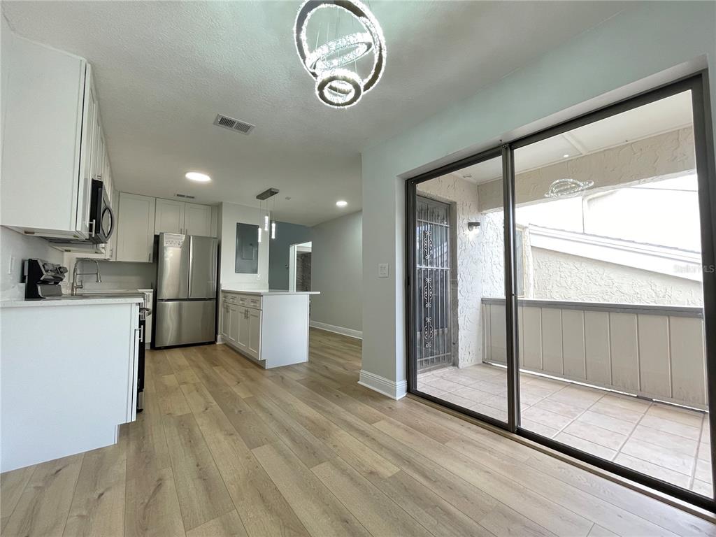 5395 Vineland Road, Unit S Orlando, FL 32811 - Photo 12 of 30 a view of kitchen with stainless steel appliances refrigerator oven and cabinets