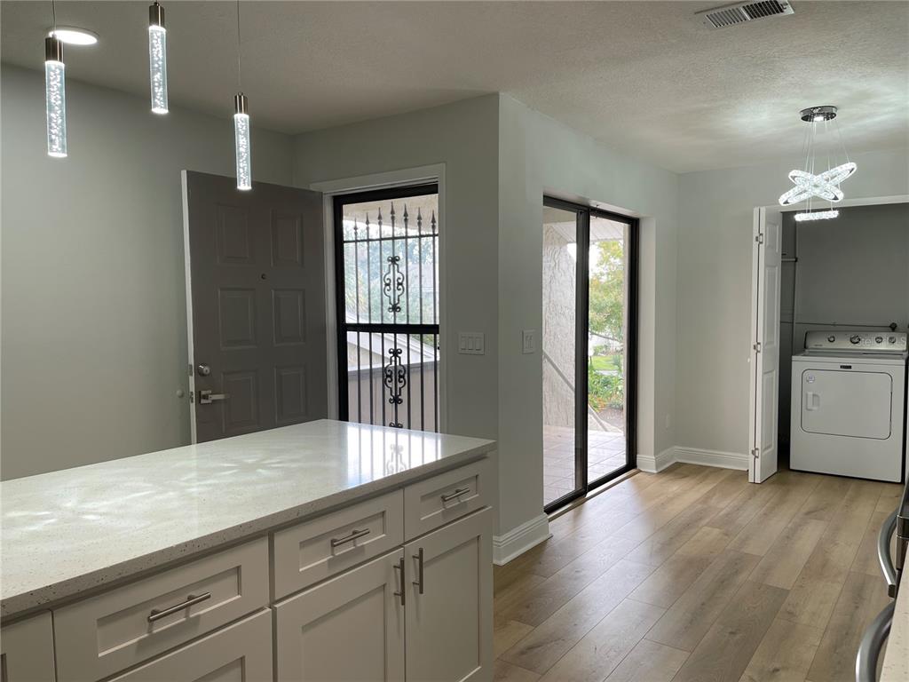 5395 Vineland Road, Unit S Orlando, FL 32811 - Photo 13 of 30 a kitchen with sink and cabinets