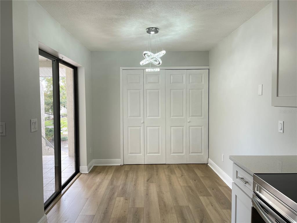 5395 Vineland Road, Unit S Orlando, FL 32811 - Photo 15 of 30 wooden floor in an empty room with a window