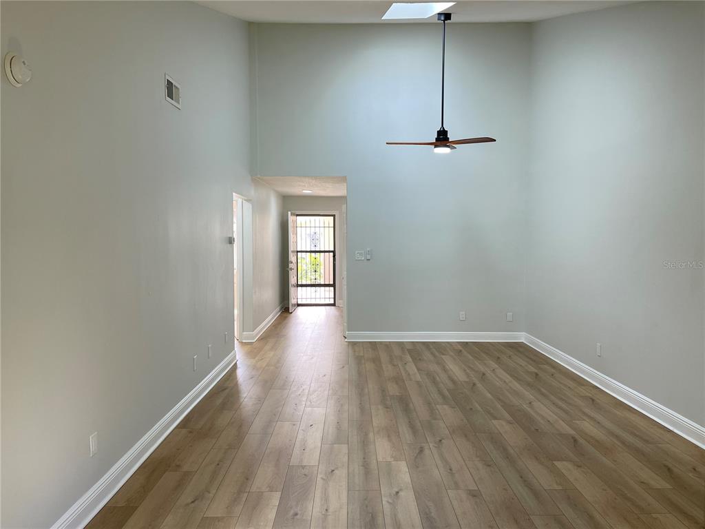 5395 Vineland Road, Unit S Orlando, FL 32811 - Photo 17 of 30 a view of empty room with wooden floor and fan