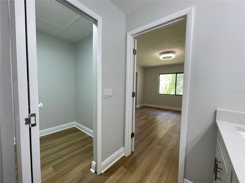 5395 Vineland Road, Unit S Orlando, FL 32811 - Photo 23 of 30 a view of a livingroom from a hallway