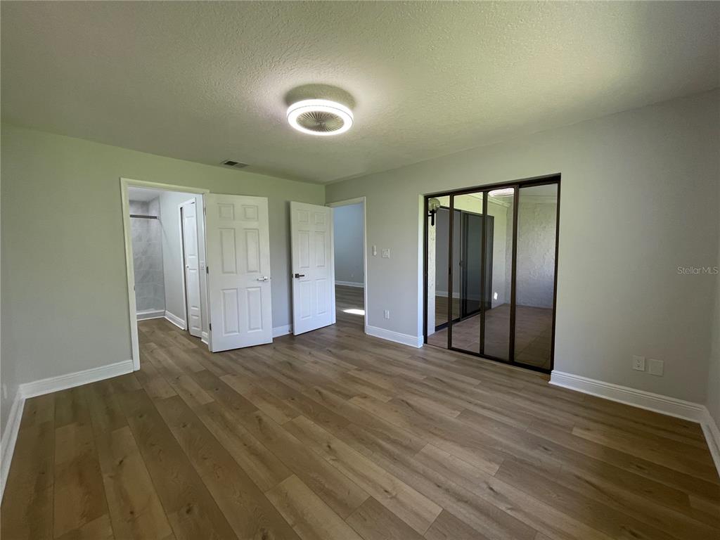 5395 Vineland Road, Unit S Orlando, FL 32811 - Photo 24 of 30 a view of empty room with wooden floor