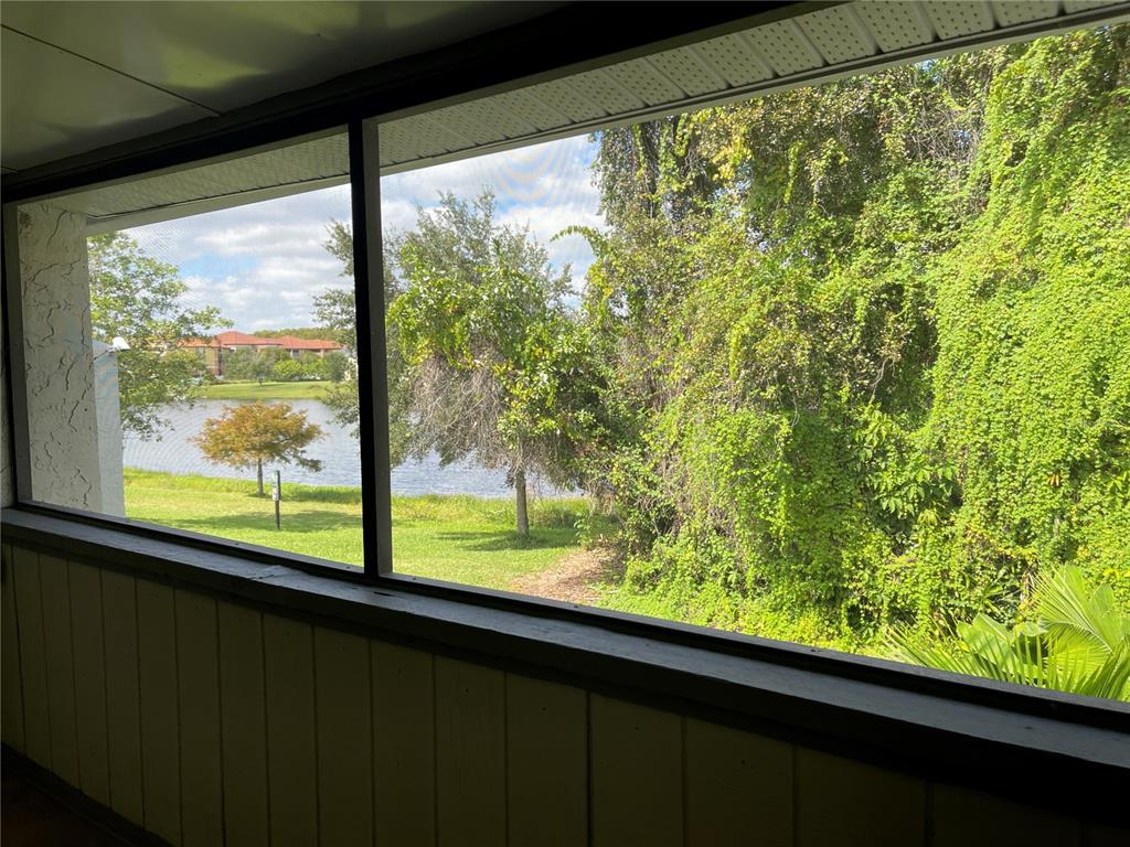5395 Vineland Road, Unit S Orlando, FL 32811 - Photo 26 of 30 a view of a green field with wooden floor and door