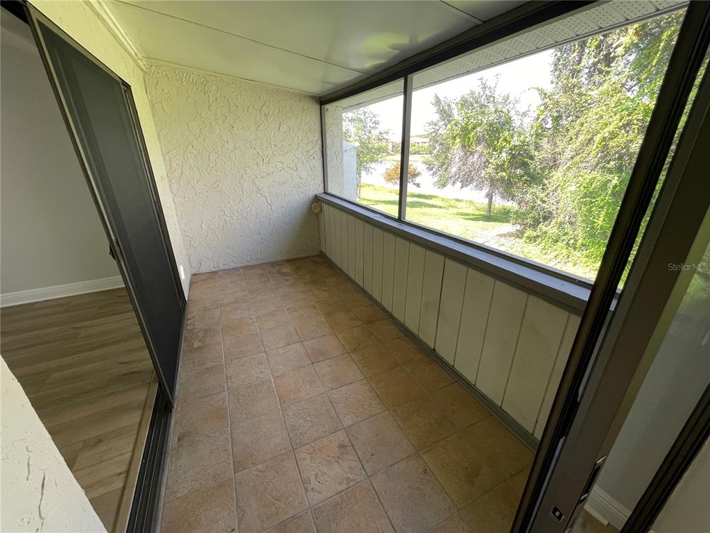 5395 Vineland Road, Unit S Orlando, FL 32811 - Photo 27 of 30 a view of an empty room with windows