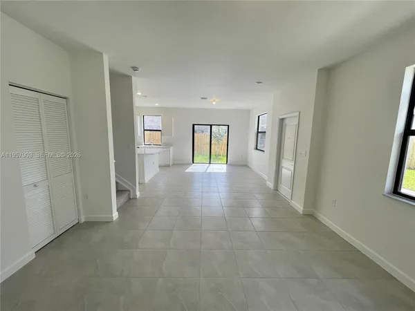 a view of a big room with closet and wooden floor