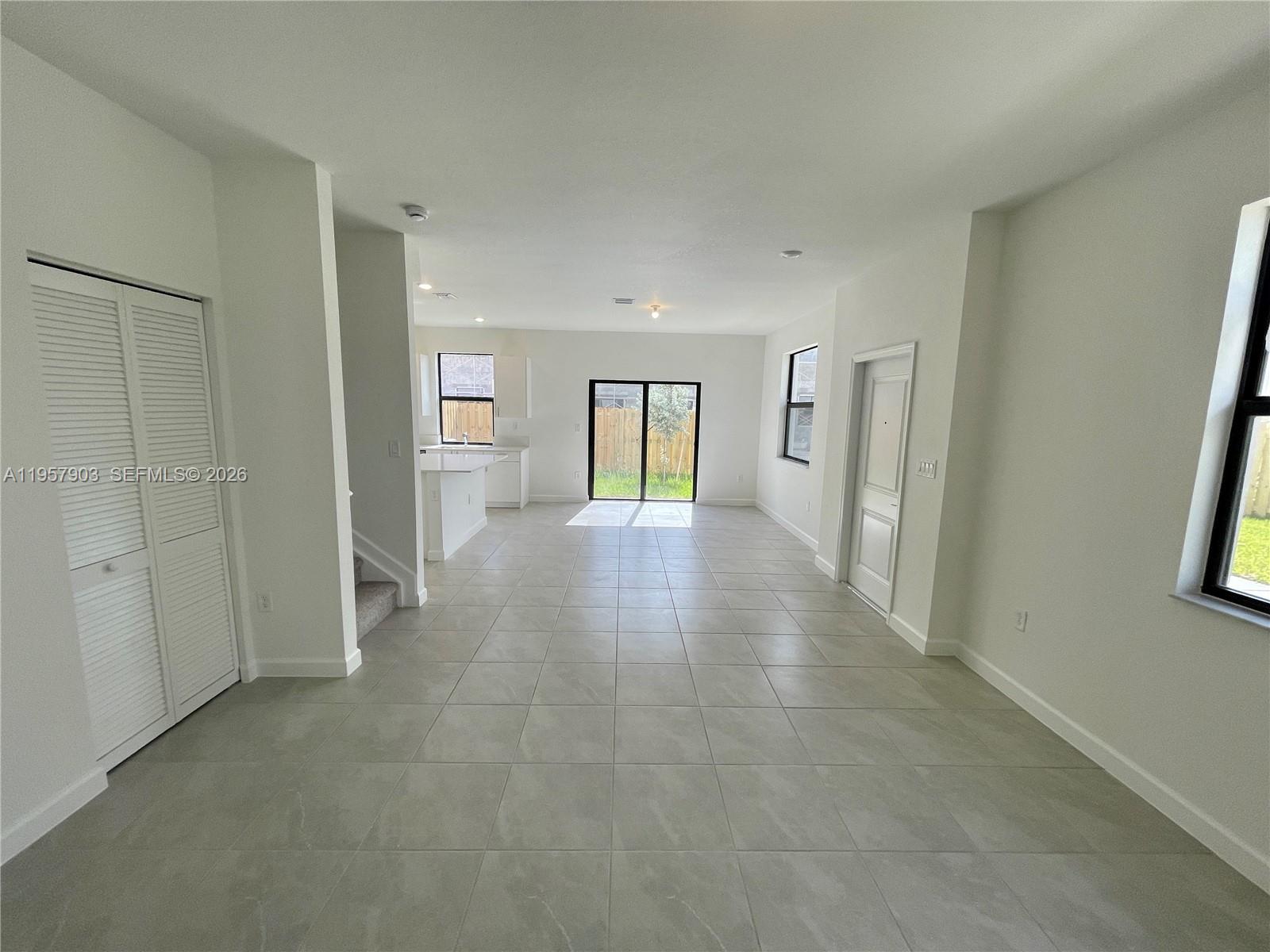 23110 Southwest 129th Place, Unit 23110 Miami, FL 33177 - Photo 12 of 29 a view of a big room with closet and wooden floor