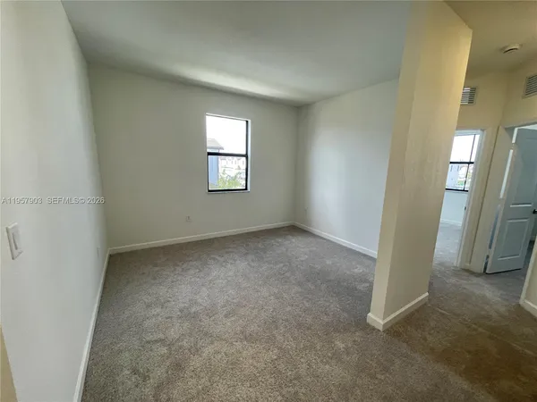 an empty room with windows