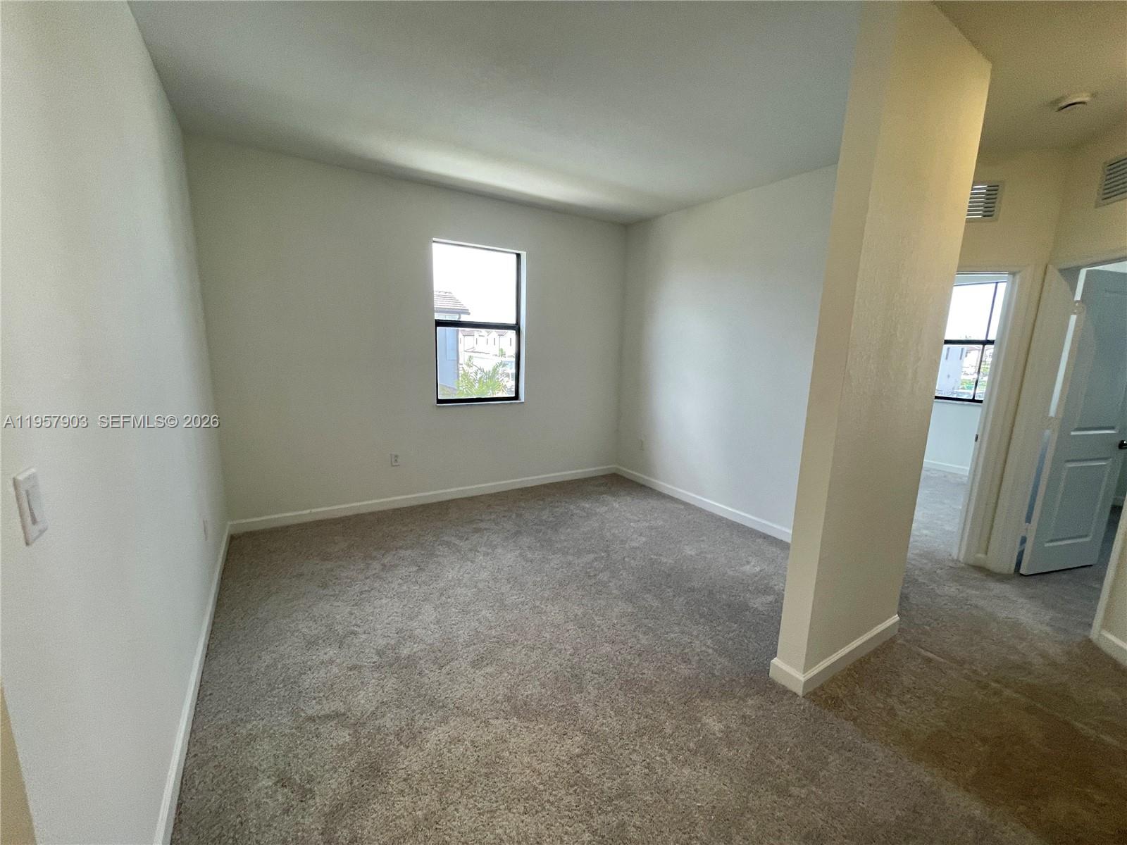 23110 Southwest 129th Place, Unit 23110 Miami, FL 33177 - Photo 15 of 29 an empty room with windows