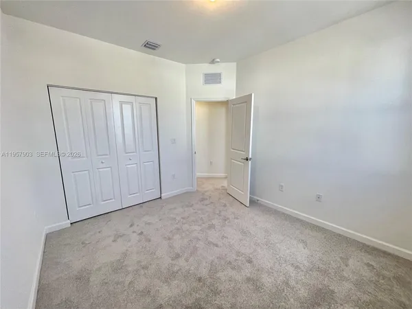 a view of cabinets and window