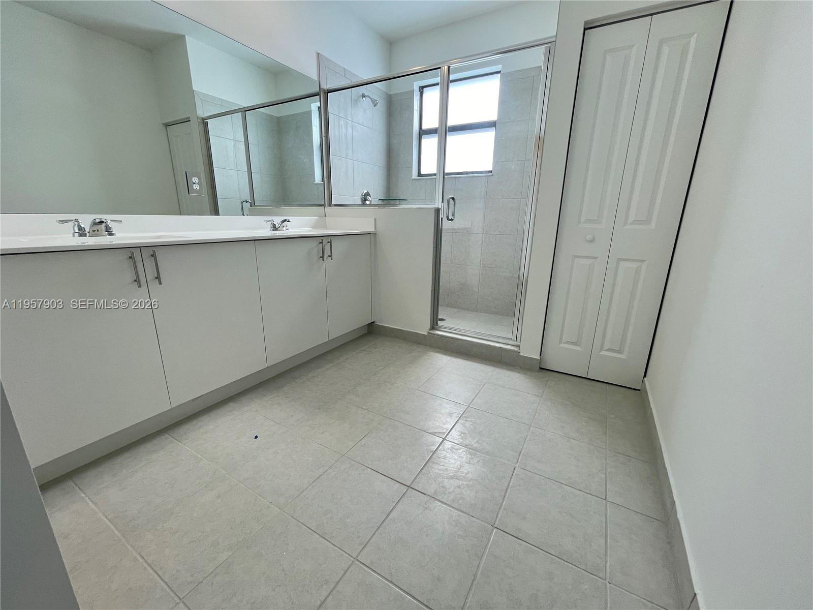 23110 Southwest 129th Place, Unit 23110 Miami, FL 33177 - Photo 23 of 29 a view of cabinets and window