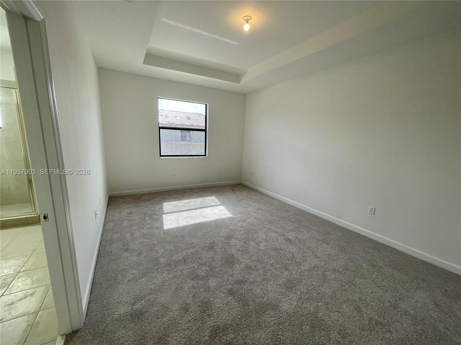 23110 Southwest 129th Place, Unit 23110 Miami, FL 33177 - Photo 24 of 29 an empty room with windows