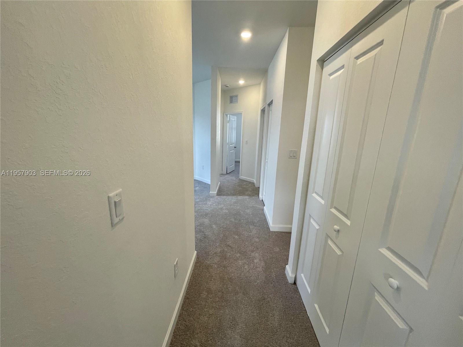 23110 Southwest 129th Place, Unit 23110 Miami, FL 33177 - Photo 26 of 29 a view of a hallway