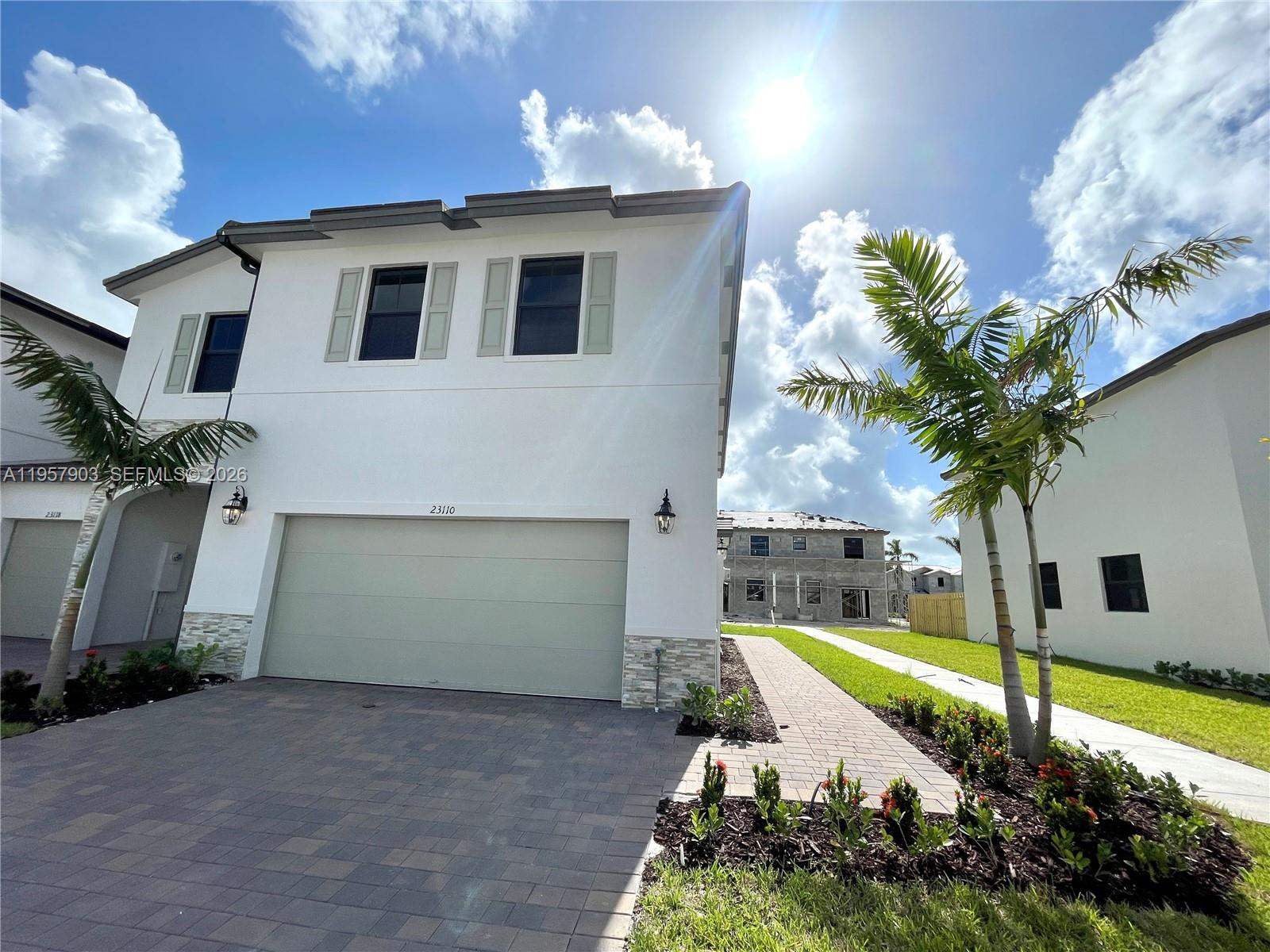 23110 Southwest 129th Place, Unit 23110 Miami, FL 33177 - Photo 3 of 29 a view of a house with a yard and swimming pool