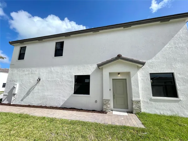 a house view with a garden space