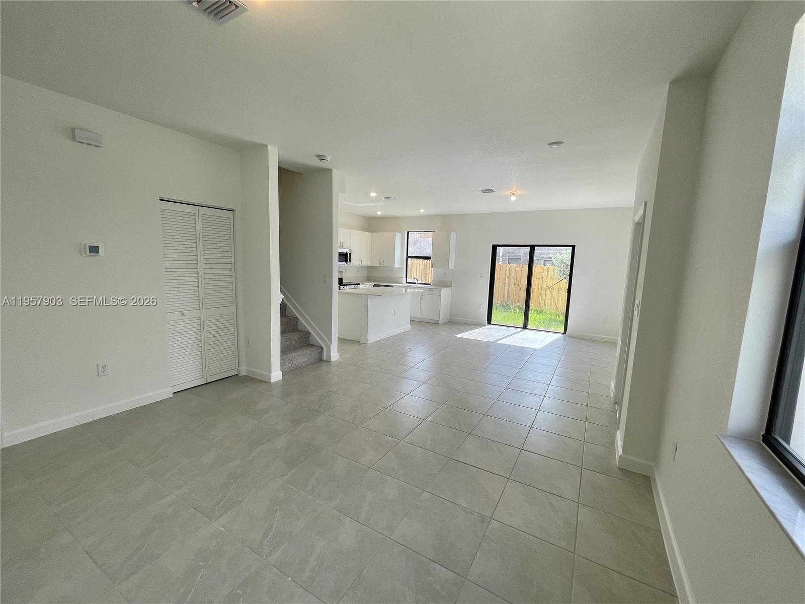 23110 Southwest 129th Place, Unit 23110 Miami, FL 33177 - Photo 5 of 29 a view of an empty room and fire place