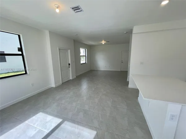 a view of a room with window and stairs