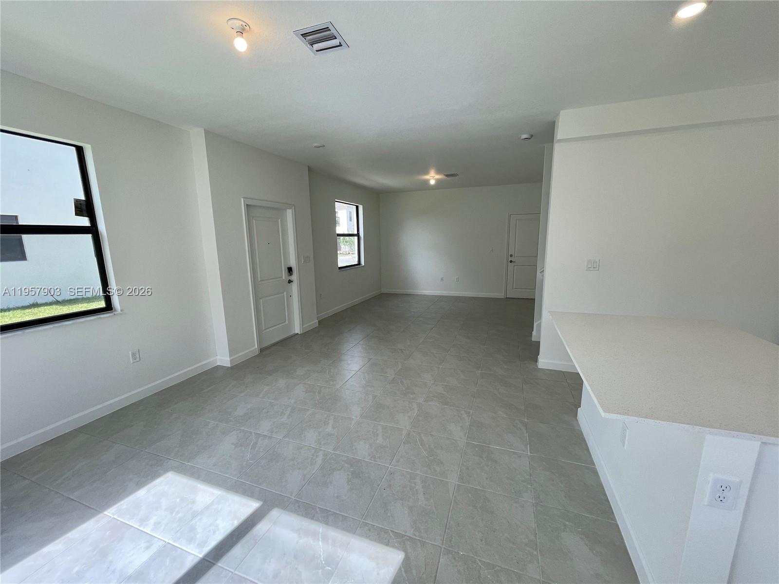 23110 Southwest 129th Place, Unit 23110 Miami, FL 33177 - Photo 10 of 29 a view of a room with window and stairs