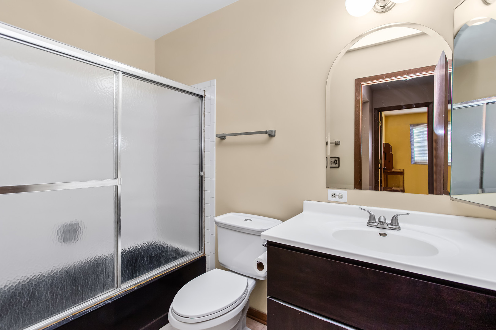 134 Virginia Court Streamwood, IL 60107 - Photo 13 of 25 a bathroom with a sink a toilet and shower