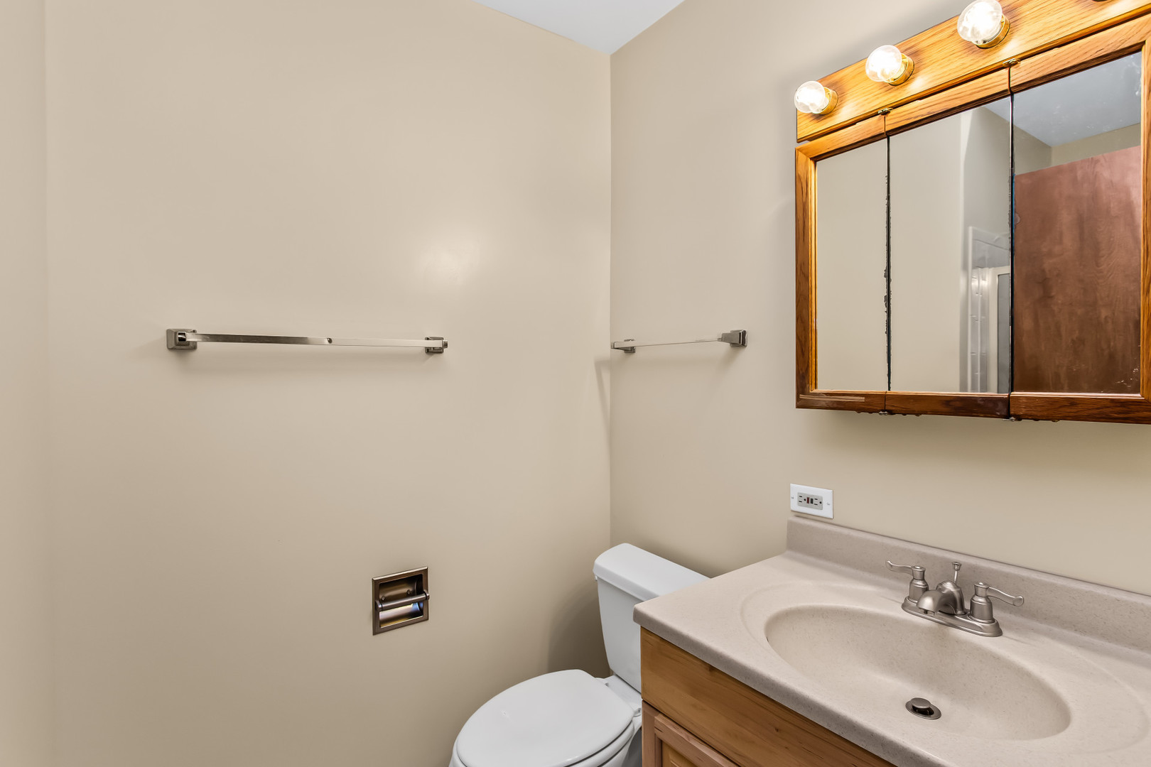 134 Virginia Court Streamwood, IL 60107 - Photo 14 of 25 a bathroom with a sink toilet and mirror