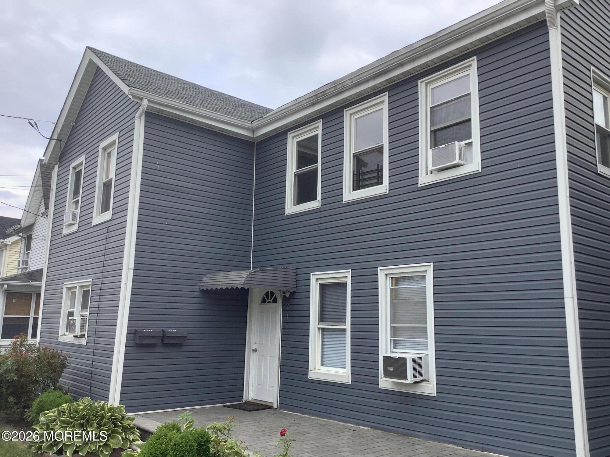 242 1st Street Keyport, NJ 07735 - Photo 4 of 23 a front view of a house with a yard