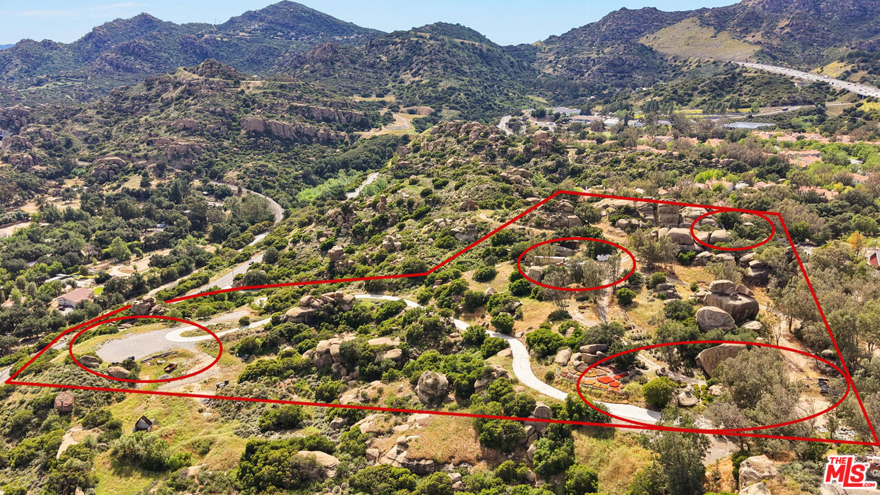 22001 Santa Susana Pass Road Chatsworth, CA 91311 - Photo 1 of 13 an aerial view of residential house and sandy dunes
