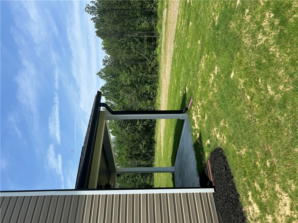202 Bellflower Lane Pendleton, SC 29670 - Photo 25 of 27 A sheltered patio area offers peaceful views of the surrounding natural landscape and open sky.