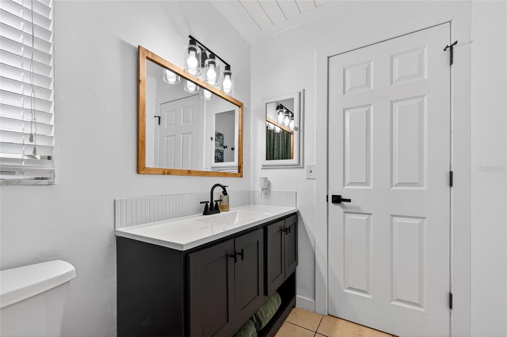 532 Center Road Venice, FL 34285 - Photo 35 of 68 a bathroom with a sink and a mirror