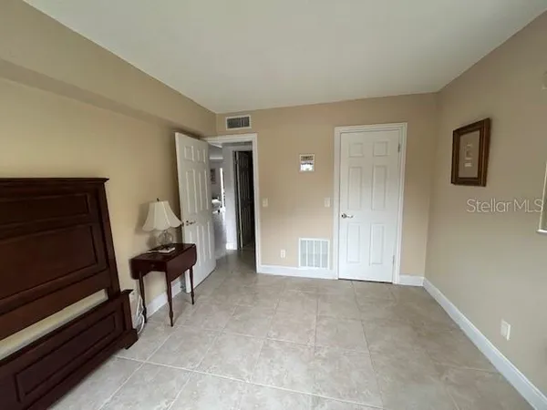 a view of an empty room and fire place