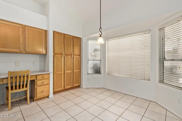 a view of a kitchen with a sink and a window