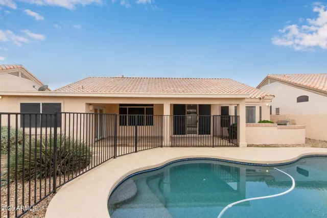 a view of a house with a small yard and plants
