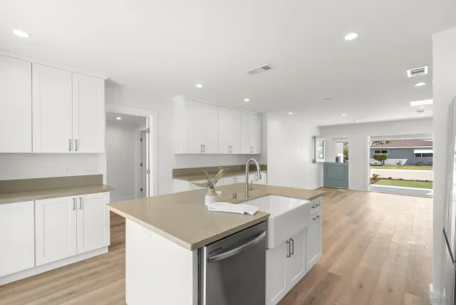 a kitchen with a sink stove and refrigerator