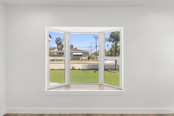 a view of a living room with a large window