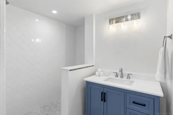 a bathroom with a sink and mirror