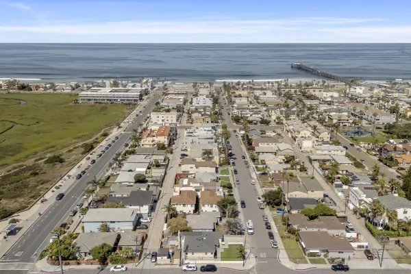 an aerial view of residential building with ocean view