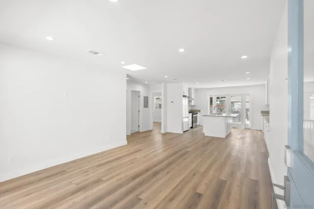 a view of a kitchen with wooden floor